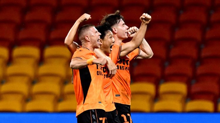 Tae-Hee Nam of the Roar celebrates with team mates after scoring a goal at Suncorp Stadium.