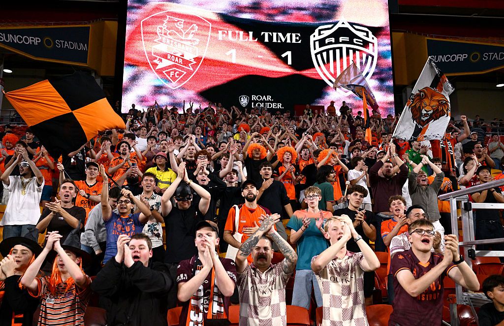 The Brisbane Roar fans show their support after the match at Suncorp Stadium.
